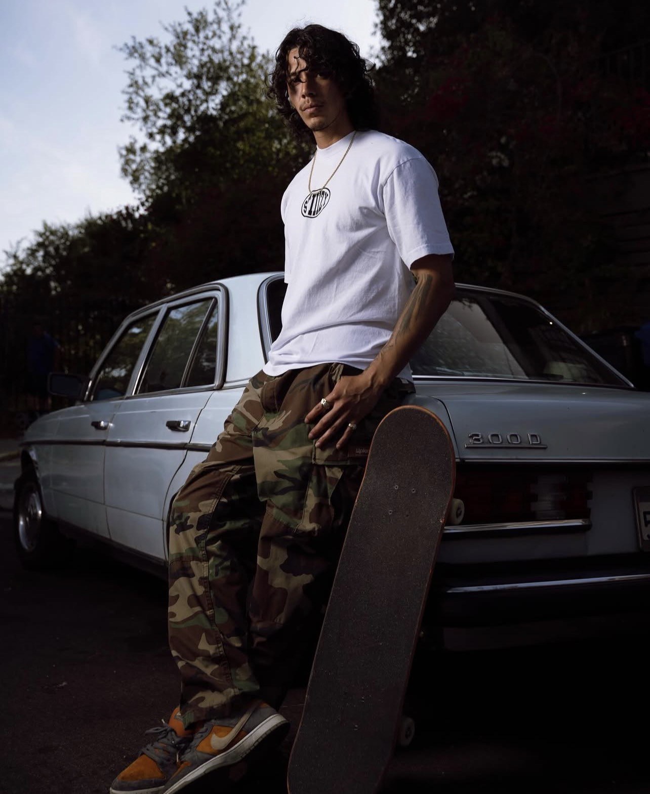 STIIIZY skate lifestyle portrait with Mercedes backdrop